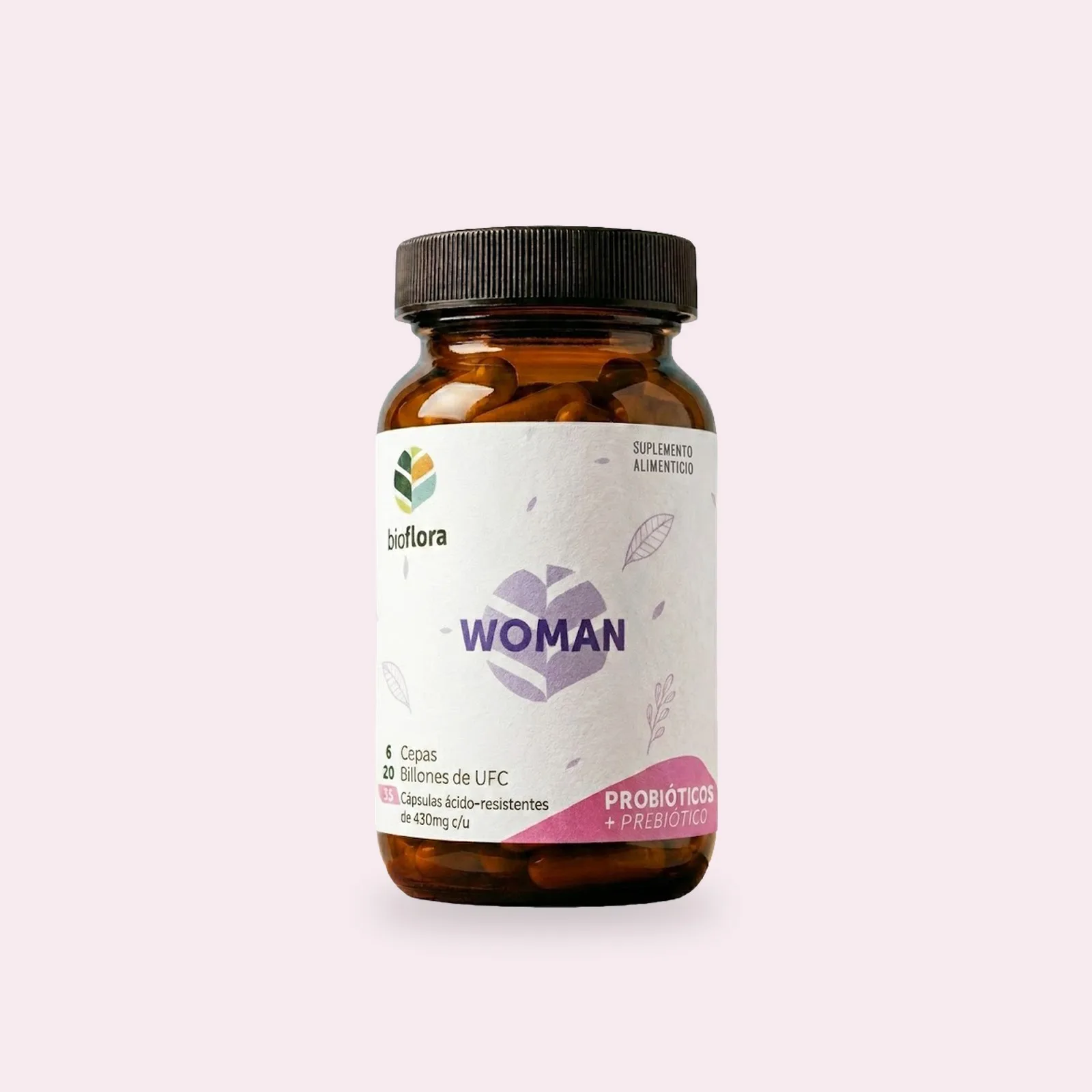 Frasco de Bioflora Woman sobre un fondo rosa muy claro; en la etiqueta, el nombre en lila sobre su flor y la banda rosa abajo.